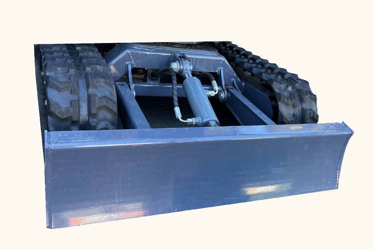 Track and blade detail on compact digger